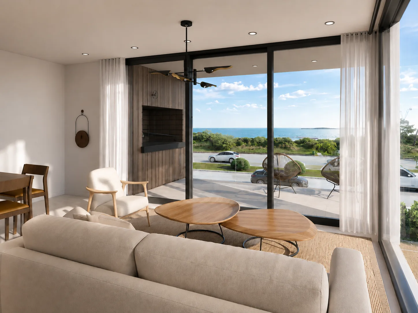 Living con ventanales y vista al mar